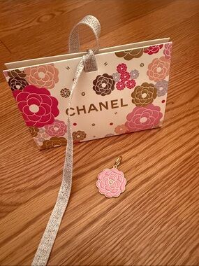 Chanel 2026 Mother’s Day mini shopping bag and pink camellia charm.